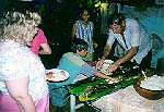 Leo serving fish at our feast at the Hibiscus restaurant on Tahaa (John Beck).